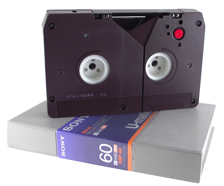 a u-matic tape sitting atop a video cassette case.
